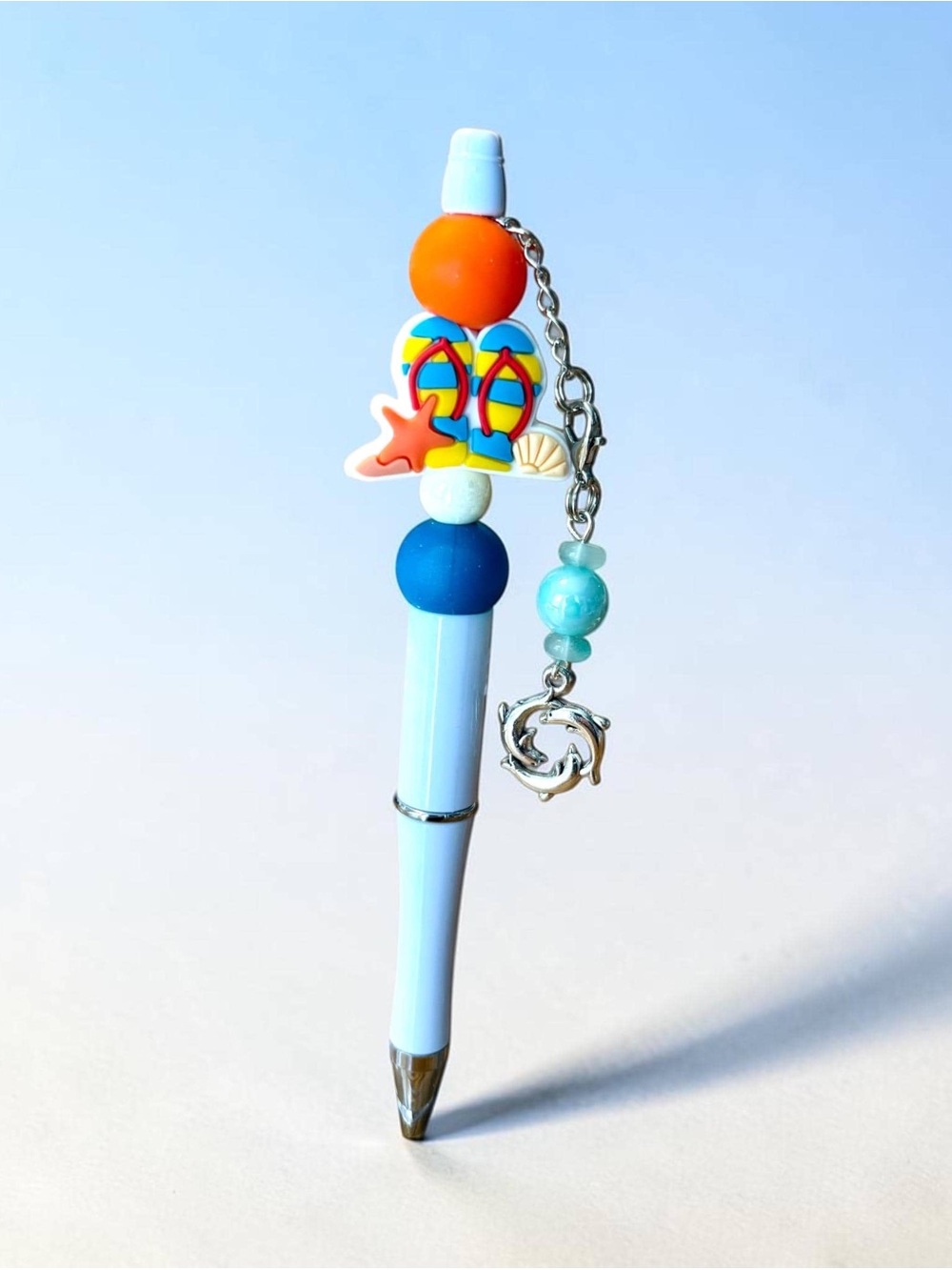 Light Blue BeachBeaded Pen with Flip-Flop Accent and a dolphin beaded charm